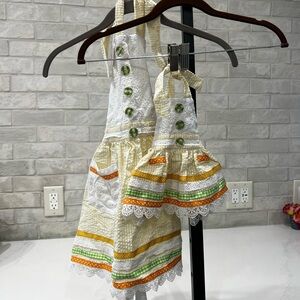 Two-piece handmade little girl and doll apron set
